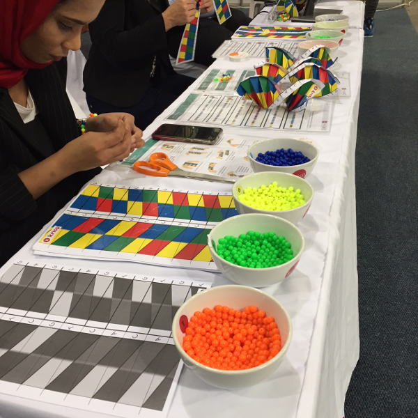 Learn about genetic variation and DNA mutations with beads and origami! Having fun with high school children in  South Africa