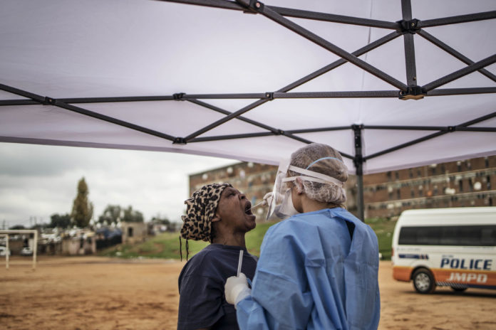 Screen test: The number of tests done is irrelevant if the results aren't being processed quickly enough and no one really knows how prepared they are until the wave hits, specialists have said. (Marco Longari/AFP)