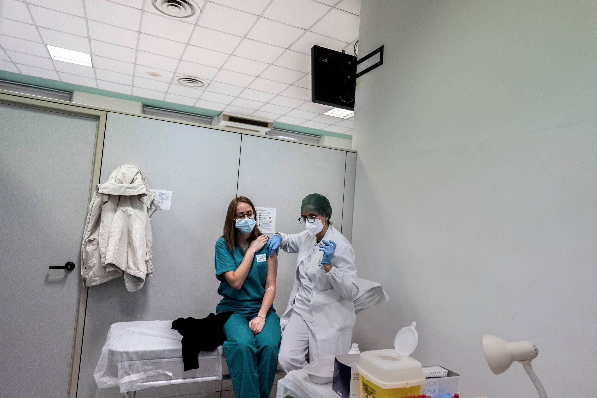 Doctors, nurses and health care assistants began receiving the coronavirus vaccine at a hospital in Piacenza, Italy, in December.Credit...Alessandro Grassani for The New York Times